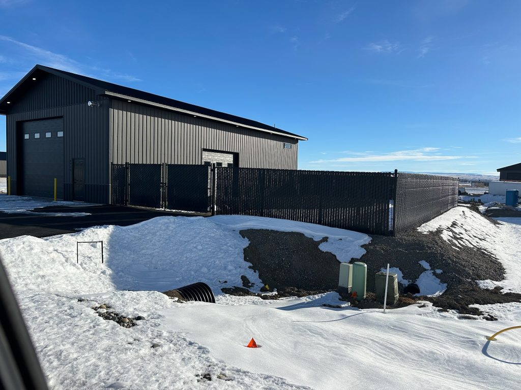 single door shop world building with fence around perimeter