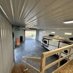 angle from balcony looking onto camper and out both garage doors