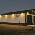 white and black shop with two doors man door during night time